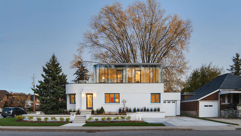 A two story Art Deco home, in white, located at 1234 House Lane, Langsley, VA 90210 and listed for $650,000.