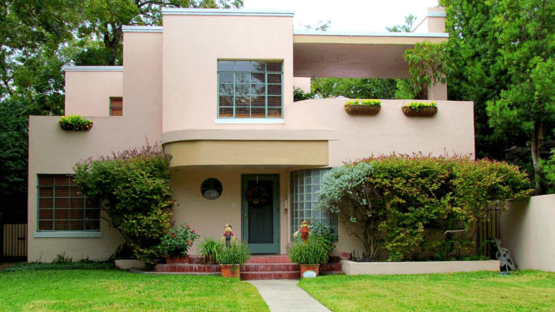 A two story Art Deco home, in pink with bushes in front, located at 1234 House Lane, Langsley, VA 90210 and listed for $650,000.